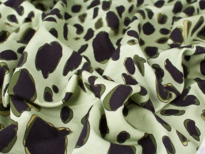Strickstoff grüne Pantherprint