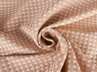 Jakardi Jind - Valkoisia pilkkuja beige-taustalla