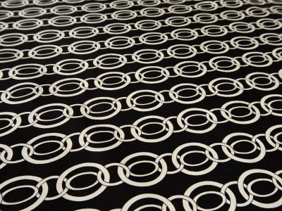Viscose fabric with a delicate sheen — chain-like pattern on a black background