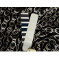 Viscose fabric with a delicate sheen — chain-like pattern on a black background