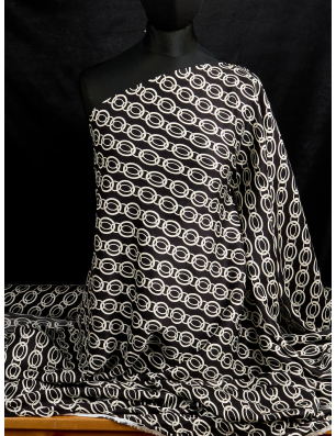 Viscose fabric with a delicate sheen — chain-like pattern on a black background