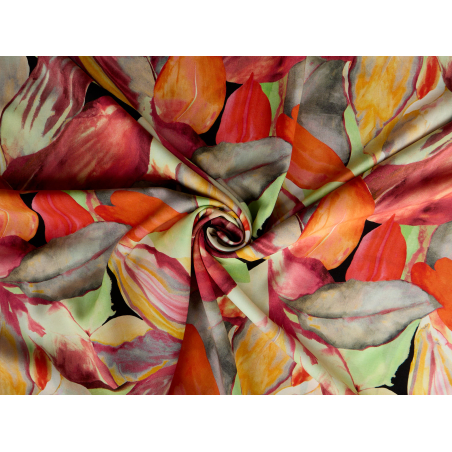 Viscose fabric for a dress in an orange and green floral pattern