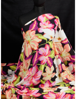 Viscose fabric for a dress in a red-orange floral pattern