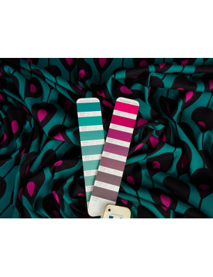 Viscose with elastane twill in a geometric turquoise and pink pattern