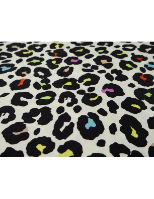Viscose fabric for a dress with a colorful leopard print on a light background