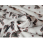 Viscose chiffon in white with the original pattern of birds and stars