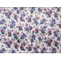 Silk satin with elastane in a floral violet pattern on a cream background